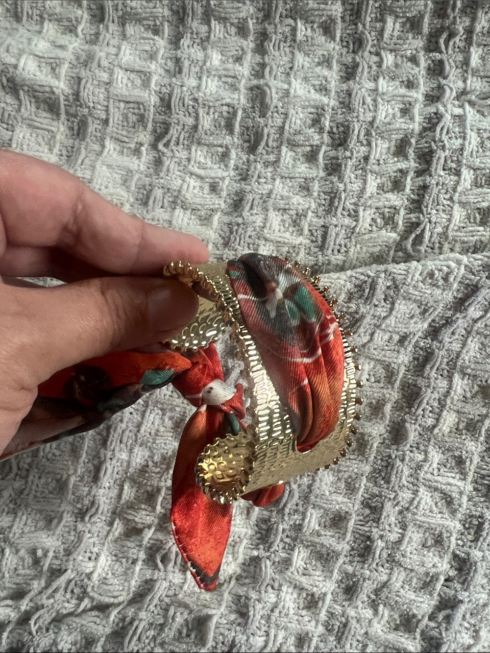 Gold Textured Cuff Bracelet with Red Floral Scarf Accent